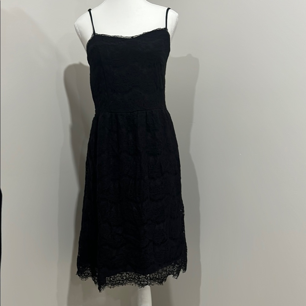 Chic Black Lace Dress with adjustable Spaghetti Straps.
